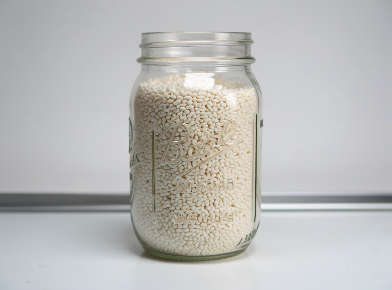 Fully colonized rye grain spawn in a jar ready to be mixed into bulk substrate